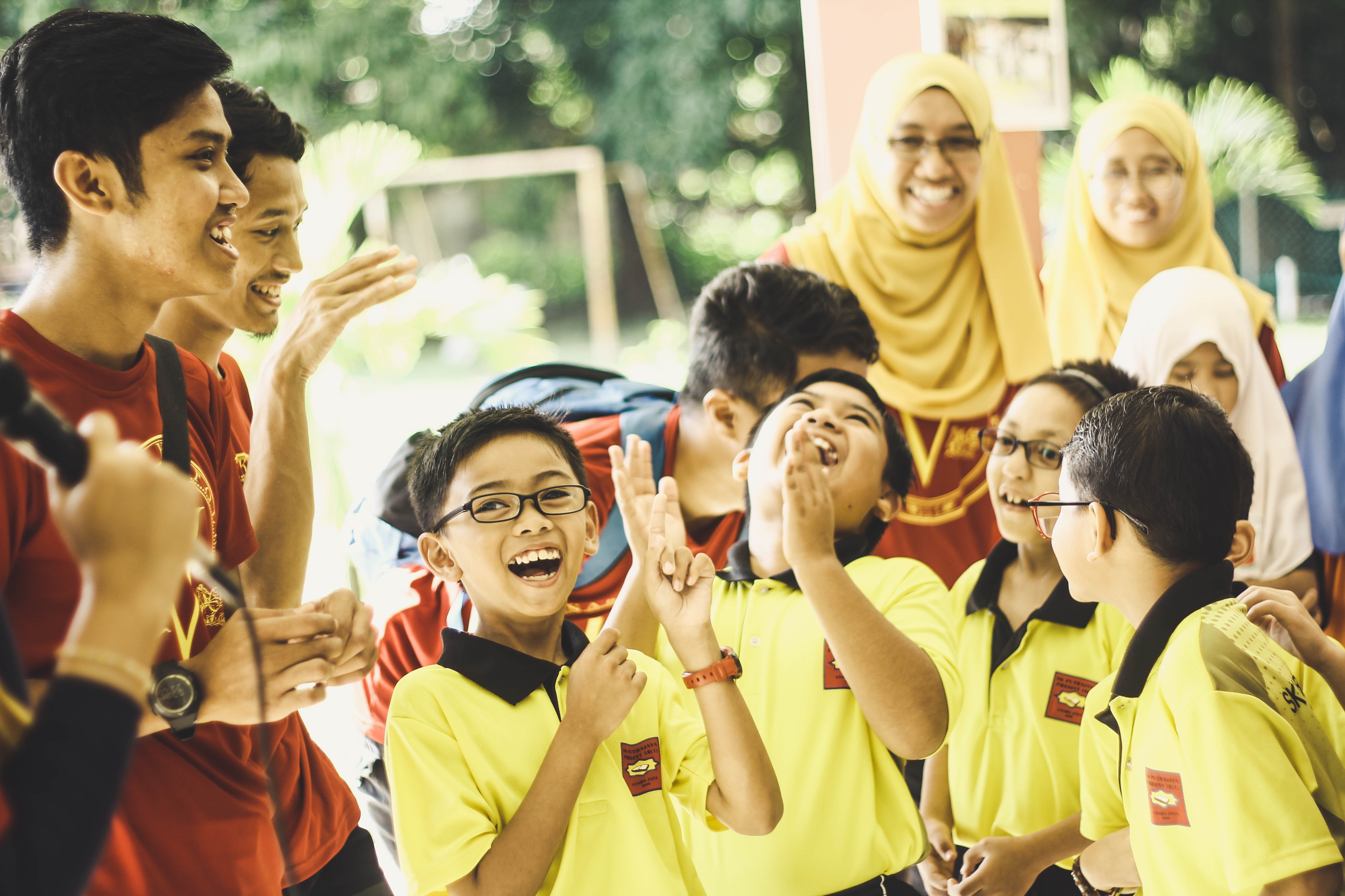 Pciture of Students laughing in School with They Teachers
